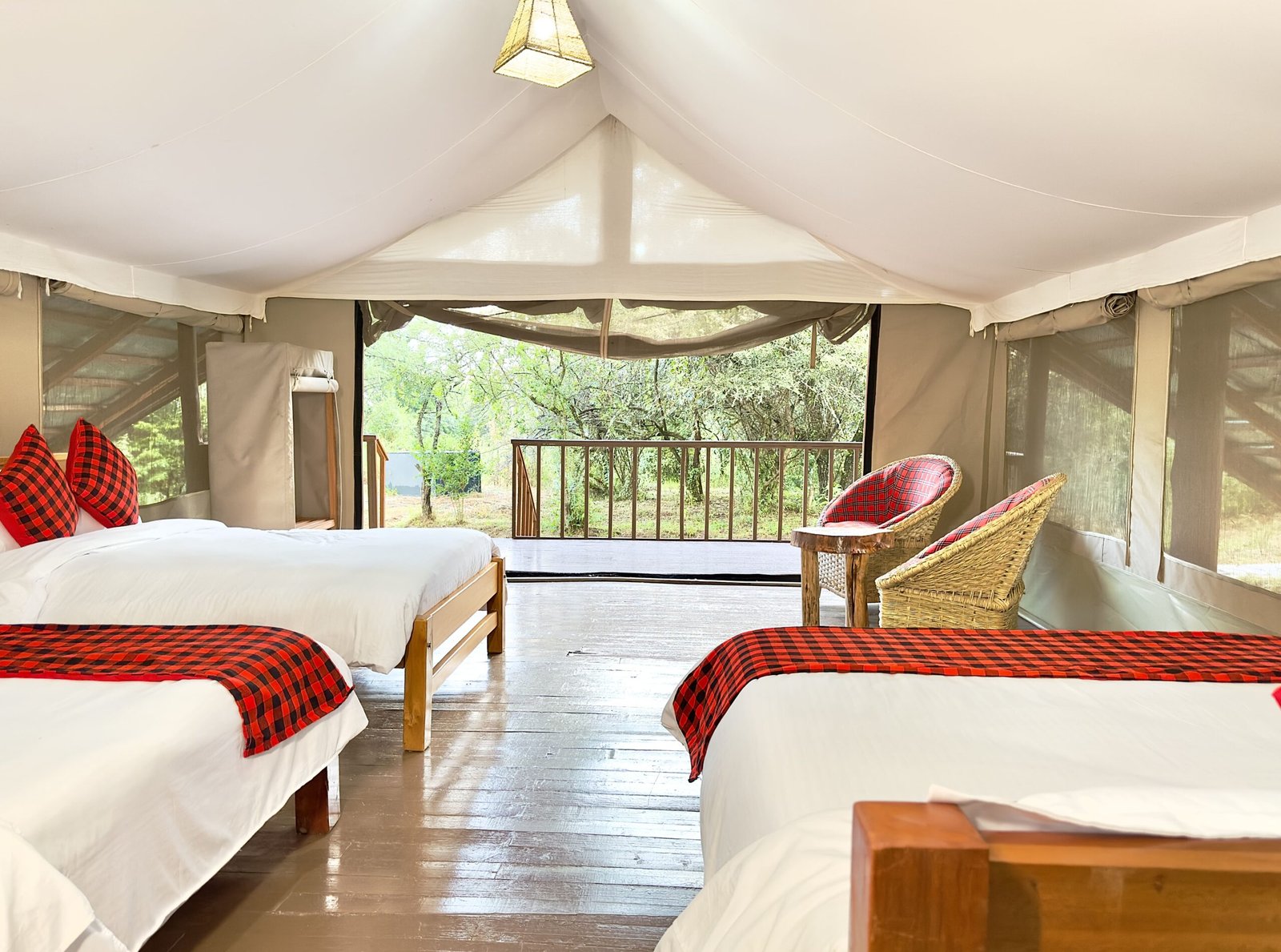 Mara Empiris Safari Camp canvas bedroom with separate beds and a wooden veranda