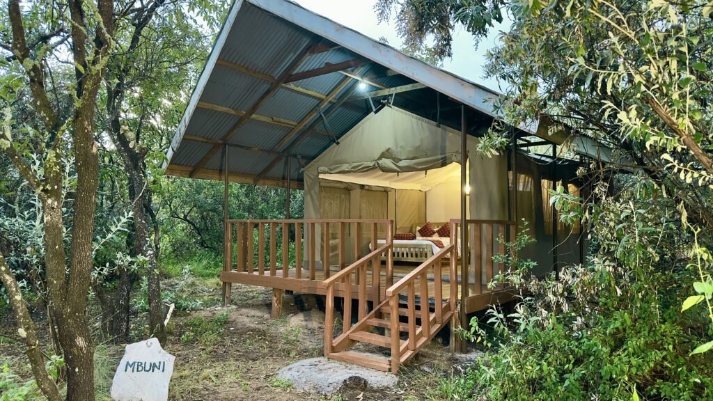 Mara Empiris Safari Camp raised canvas tent with veranda and entrance steps