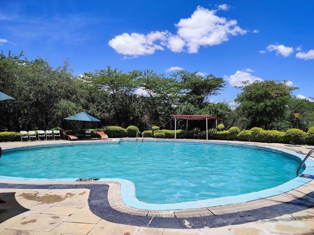 Shared outdoor pool and garden at AA Lodge Maasai Mara