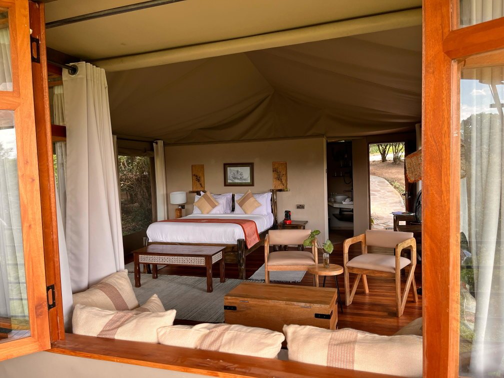 Ashnil Mara Camp contemporary canvas tent with a bedroom and separate lounge opening towards its deck