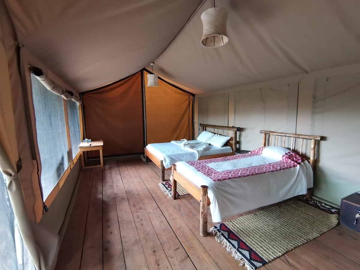Classic Mara Explorer 7 Canvas safari bedroom with beds and a writing desk