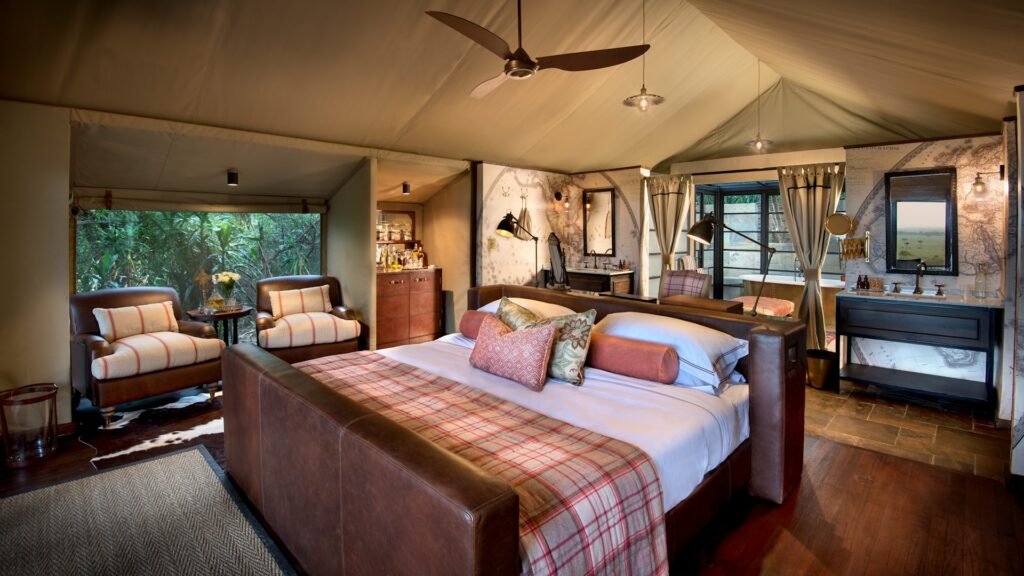 andBeyond Bateleur Luxury Tent with seating, double bed and bathroom