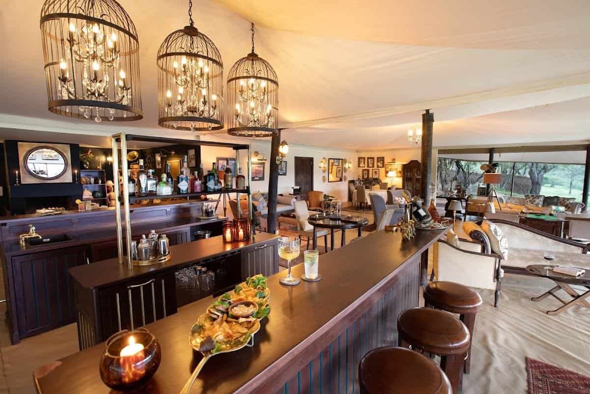 Cottar's 1920s Safari Camp bar and lounge beneath a canvas roof