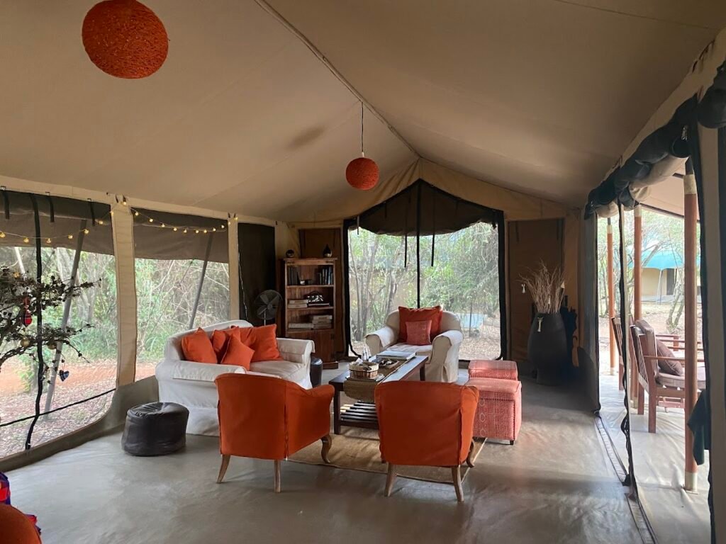 Canvas lounge and open veranda at Encounter Mara Camp