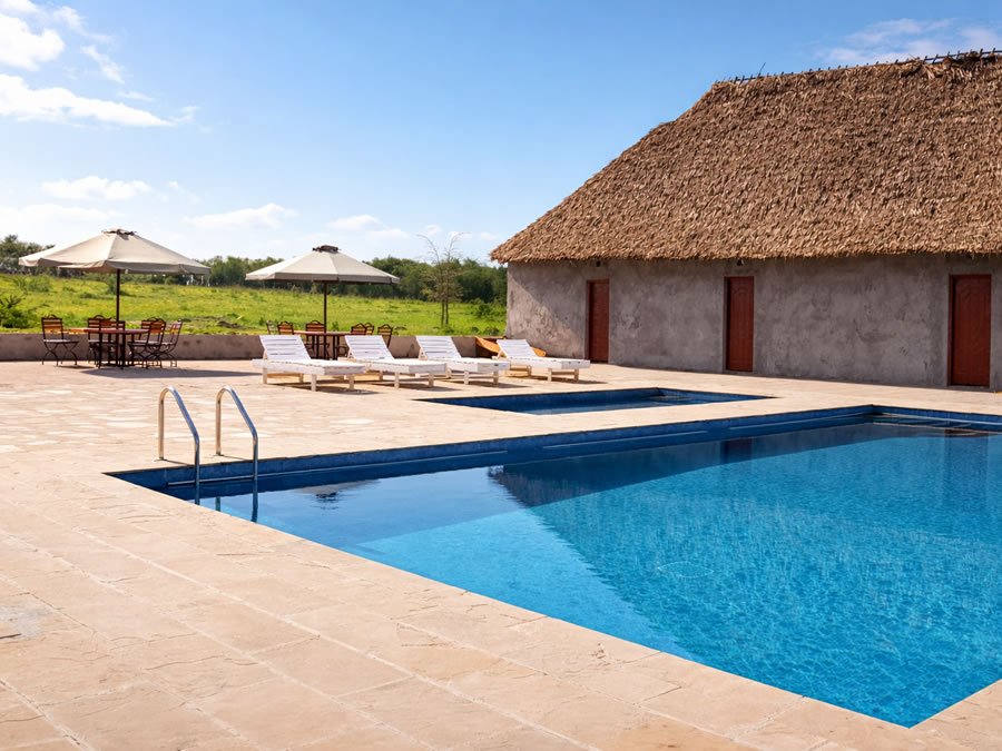 Swimming pool and sunbeds at Endeem Mara Resort