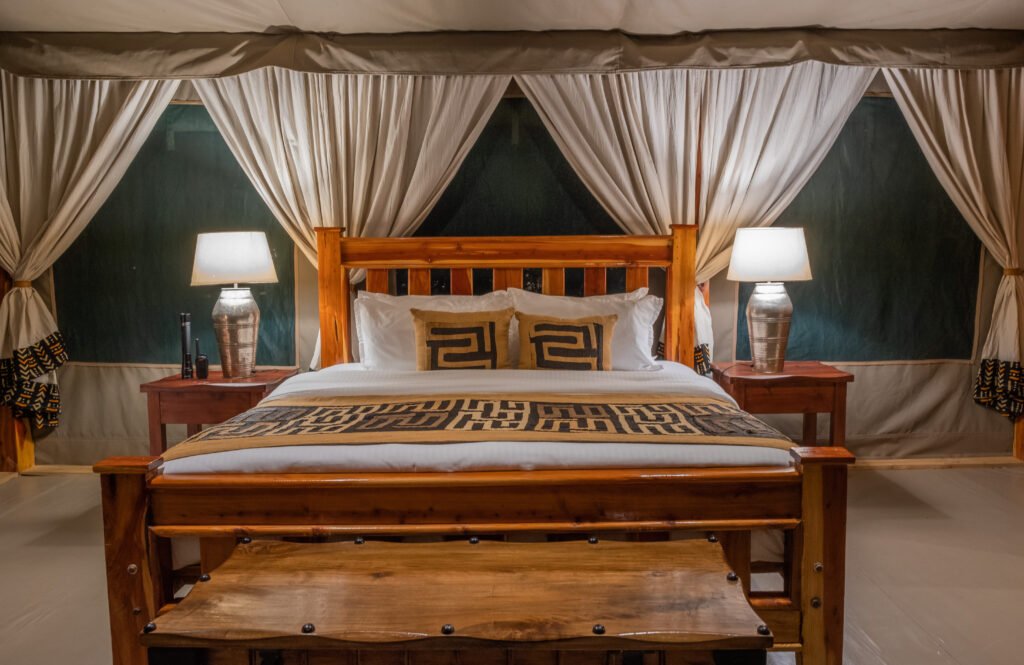 Enkakenya Mara Camp family tent double bed and bedside lamps