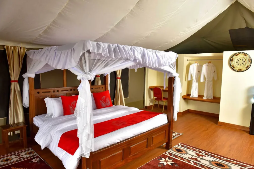 Double tent with mosquito-net bed at Enkorok Safari Camp