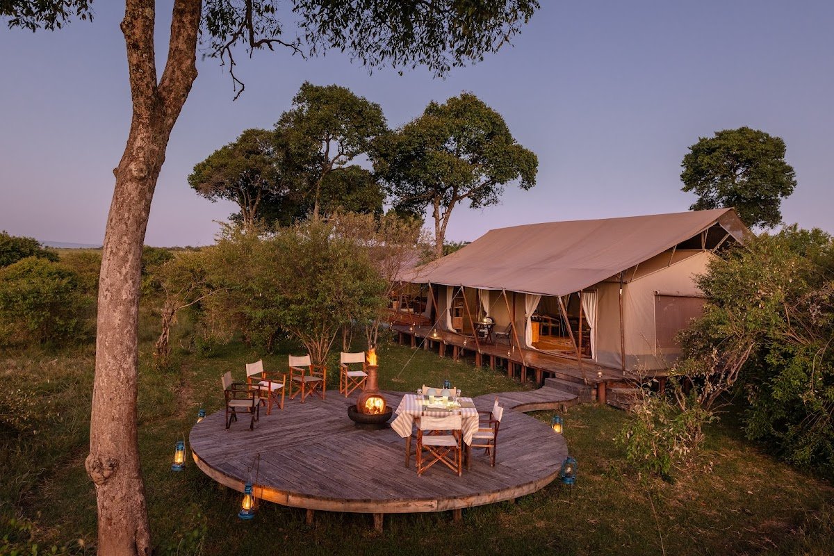Enkusero Mara communal canvas tent and circular campfire deck at dusk