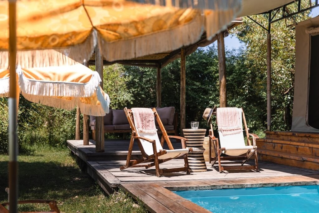 Enkusero Mara shared plunge pool beside timber decking and shaded chairs