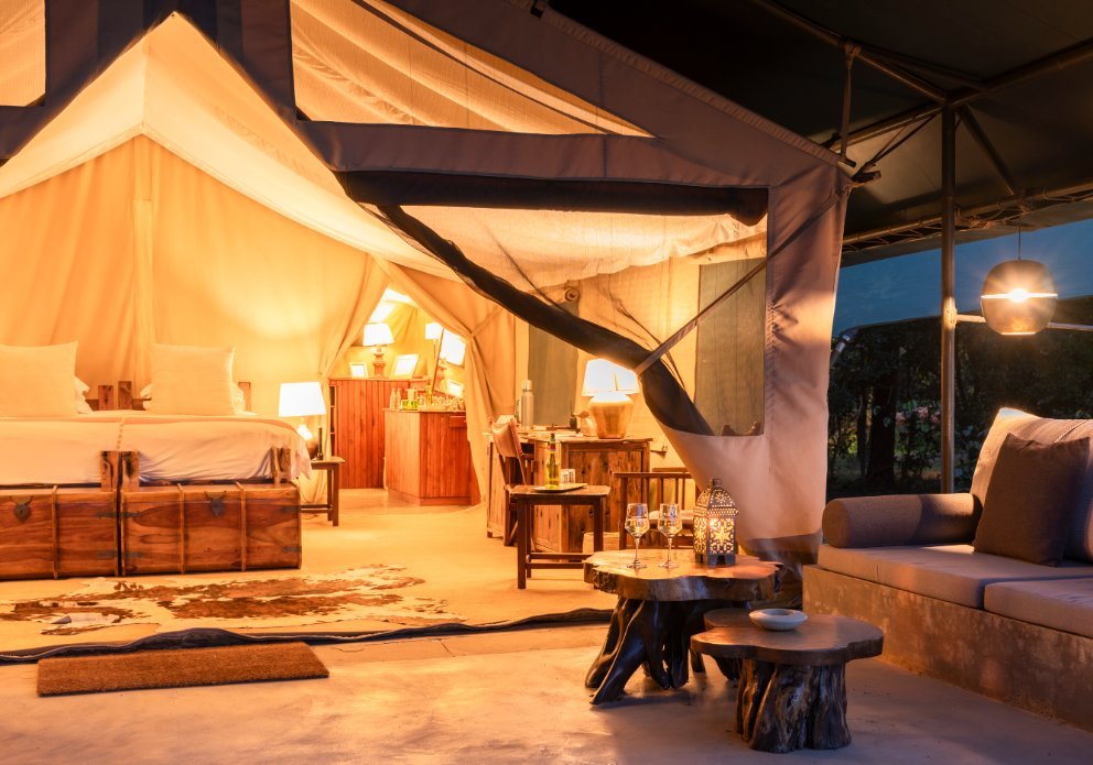 Governors' Il Moran Camp canvas guest bedroom and private veranda at dusk
