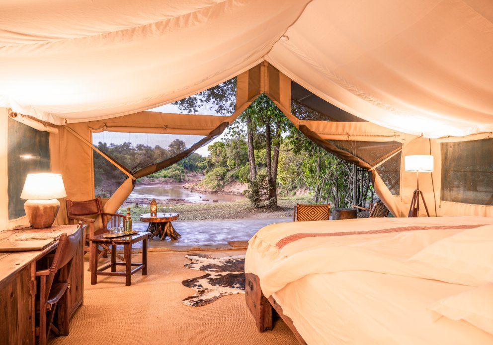Governors' Il Moran Camp guest bedroom opening onto a riverside veranda