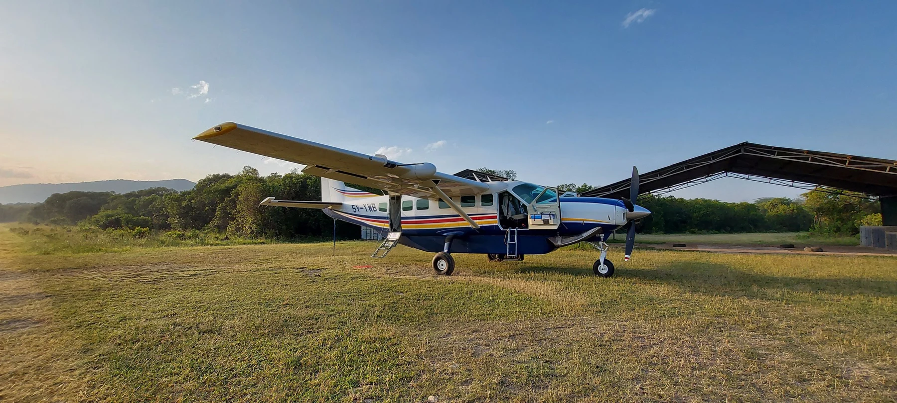 Yellow Wings flights to the Maasai Mara 1 Yellow Wings Caravan at a Maasai Mara airstrip