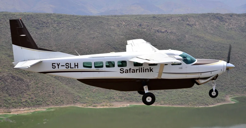 Safarilink flights to the Maasai Mara 1 Safarilink Cessna Caravan flying above a lake