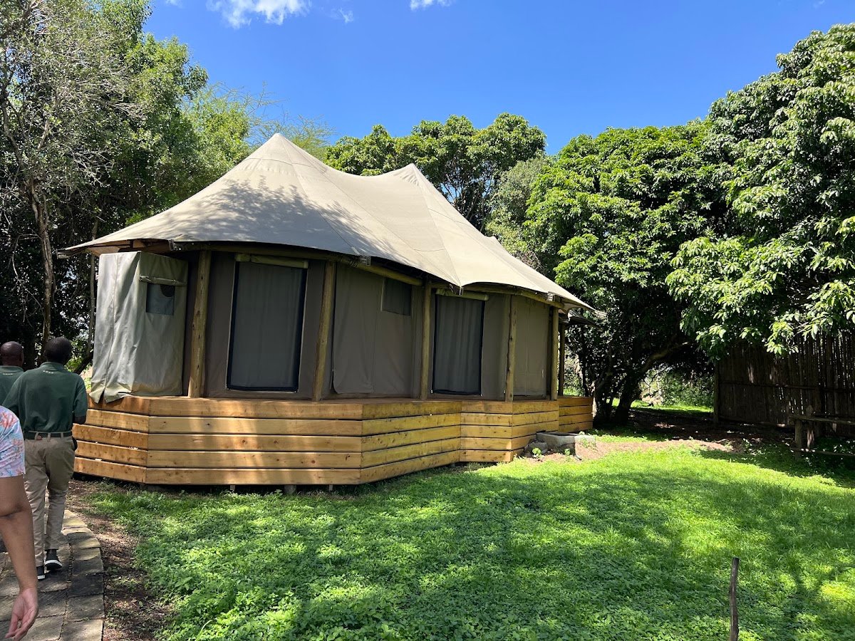 Ilkeliani Camp elevated canvas suite surrounded by the riverside garden