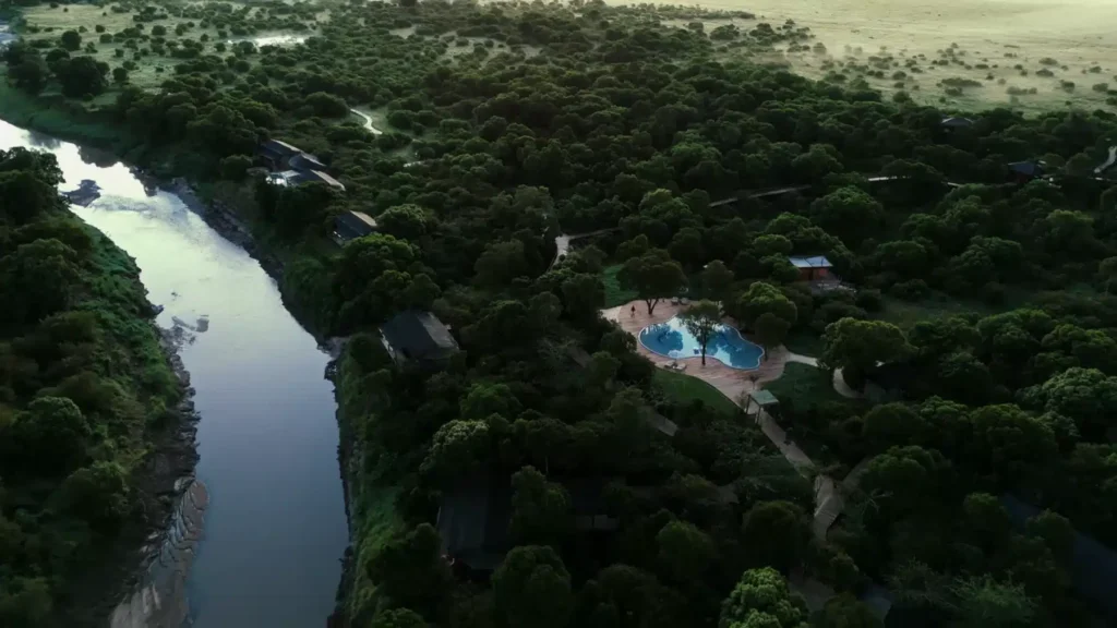 Maasai Mara lodges and camps 19 Ishara Mara aerial view of forested camp, riverside suites and shared swimming pool