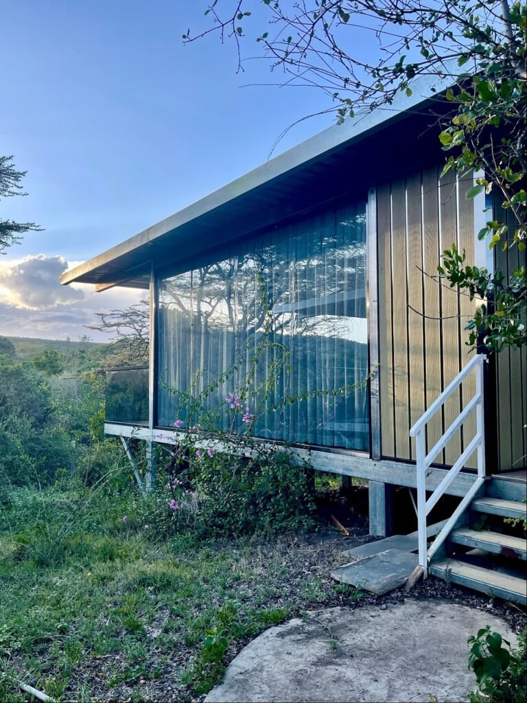 Glass-fronted cottage and steps at Jambo Mara Safari Lodge
