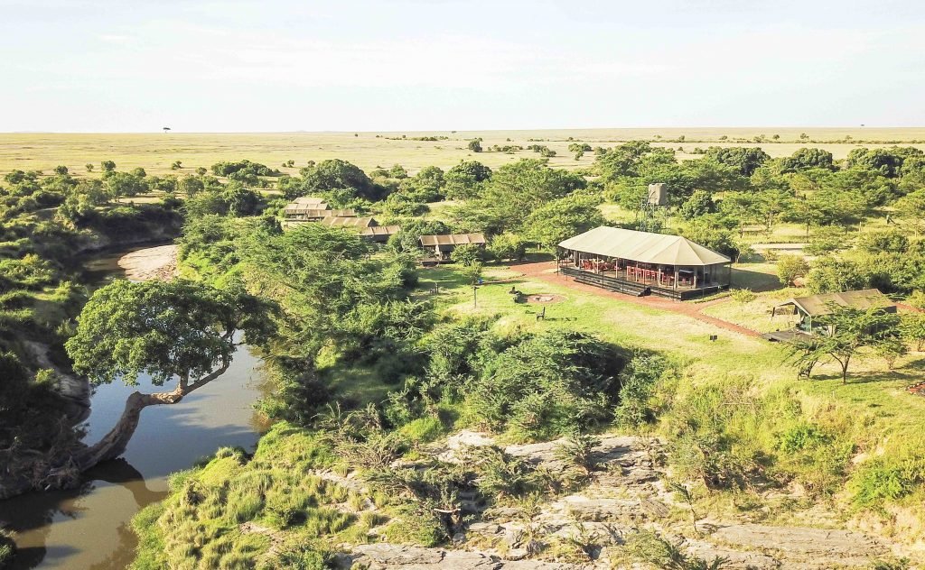 Julia's River Camp beside the Talek River, with tents and communal dining space