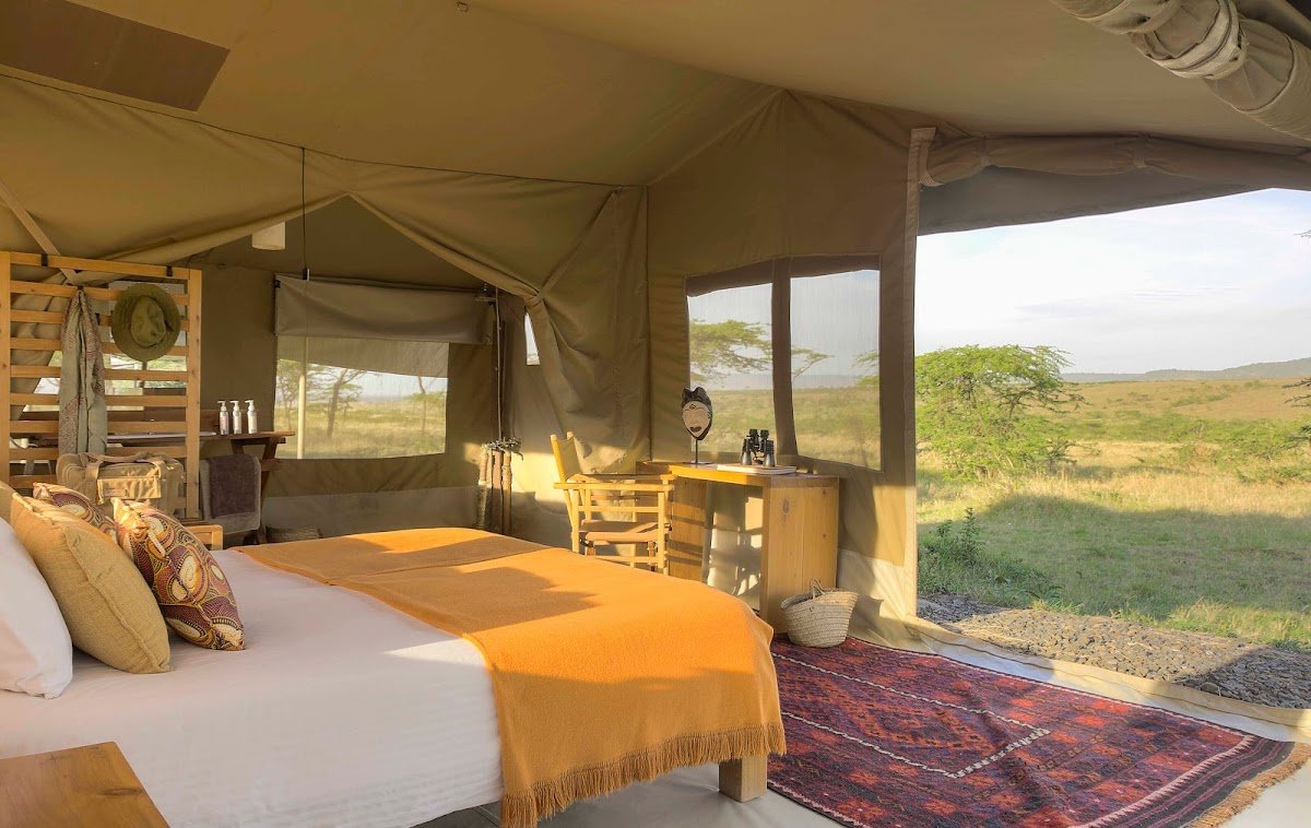 Kandili Camp canvas tent bedroom opening onto a private veranda and the Mara plains