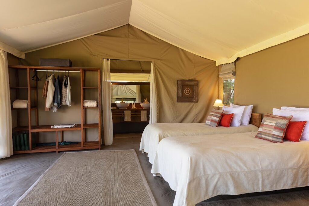 Twin beds and canvas walls in a Kicheche Mara North guest tent