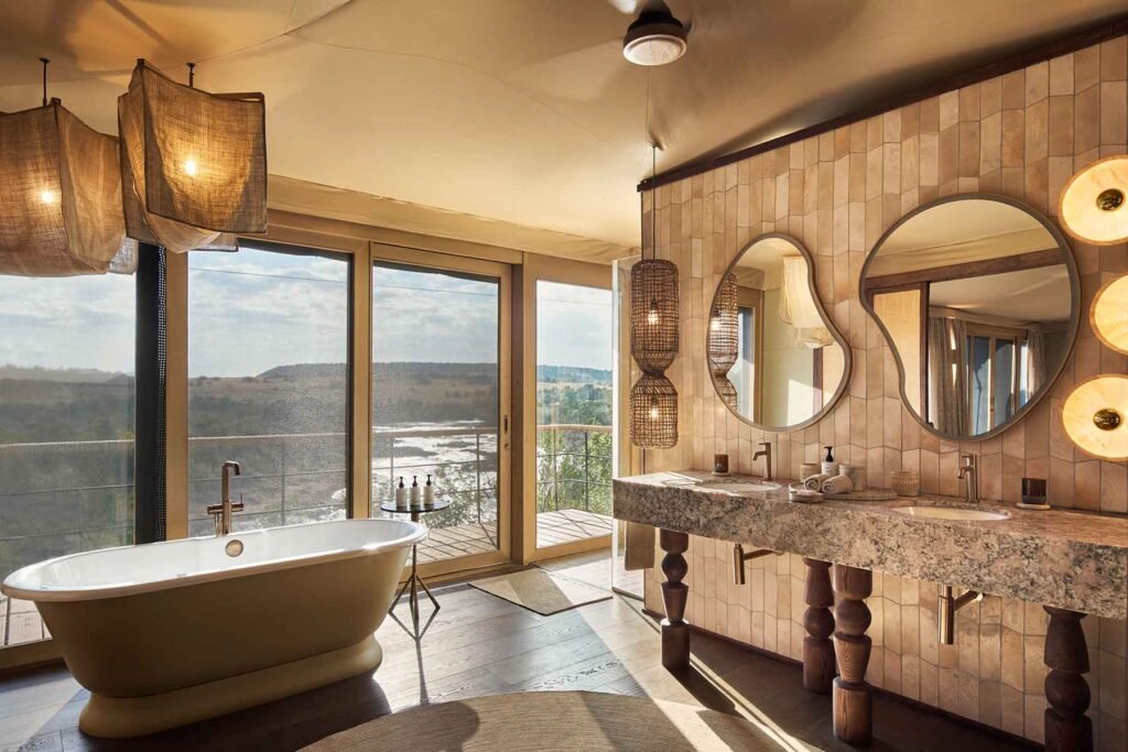 Kinara Safari Camp suite bathroom with freestanding bath and river view