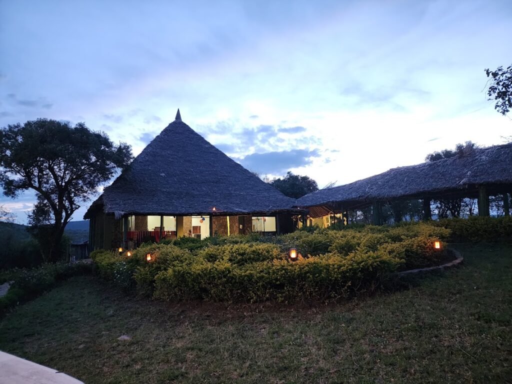 La Maison Royale Mara Camp thatched main building and garden walkway