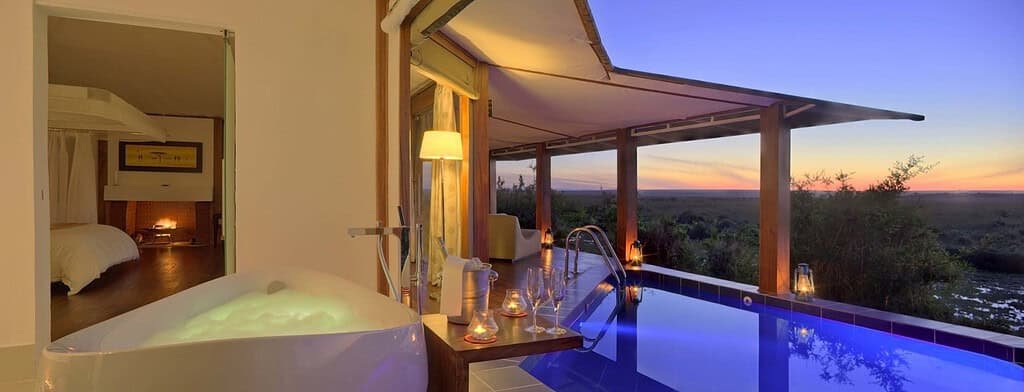 Maasai Mara lodges and camps 41 Ngerende in the Wild Lakeview private plunge pool and spa bath beside the suite veranda