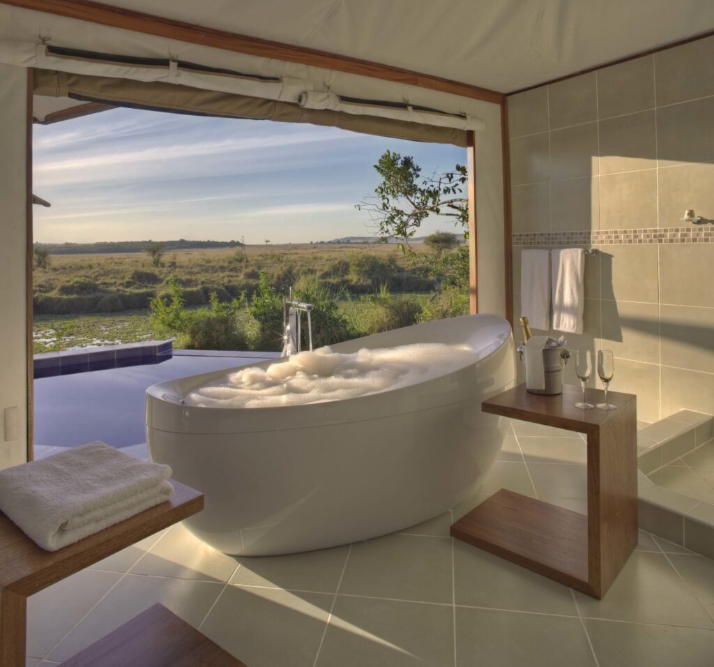 Ngerende in the Wild Lakeview bath and shower with a view towards the private plunge pool