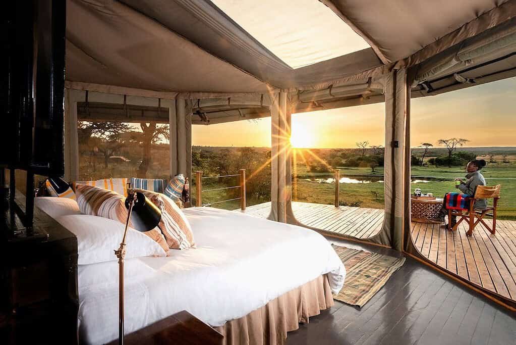 Morning sunlight across a Saruni Leopard Hill tent bedroom and private veranda