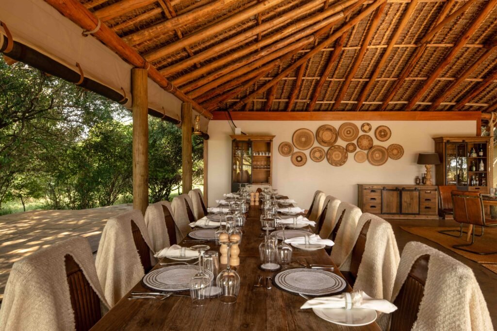 Dining tables and guest seating in the Lerai Safari Camp main area
