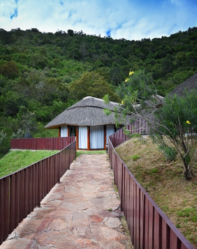 Stone path and veranda approaching a thatched suite at Lilita Keper