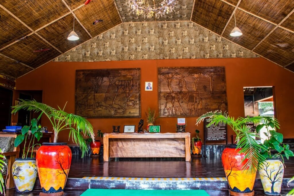 Maasai Mara lodges and camps 28 Mara Chui Resort reception hall with carved wall panels and a reed ceiling