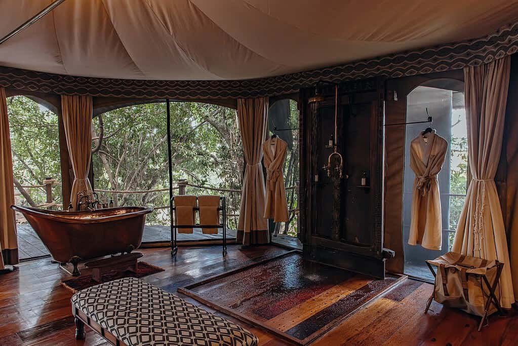 Copper bath and canvas bathroom in a Mara Plains Camp Safari Suite