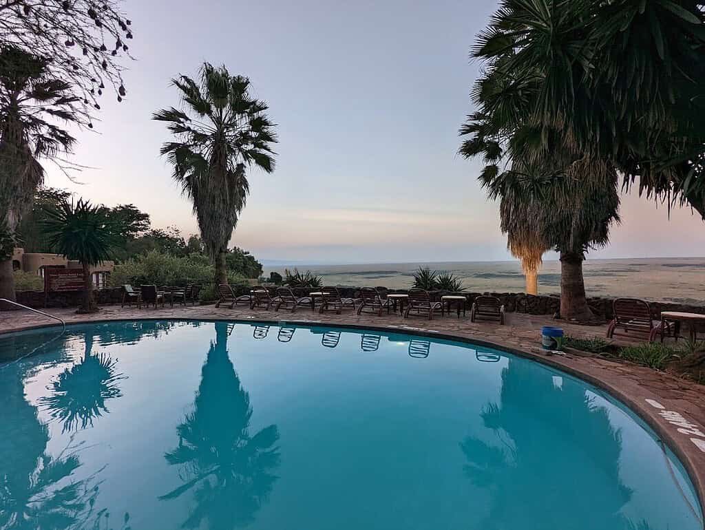 Swimming pool and sun loungers overlooking the plains at Mara Serena Safari Lodge