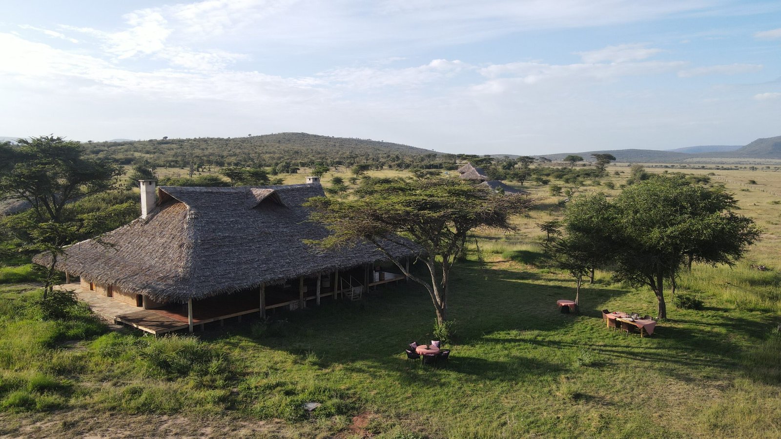 Mara Siana Camp main canvas and thatch building beside the open plains
