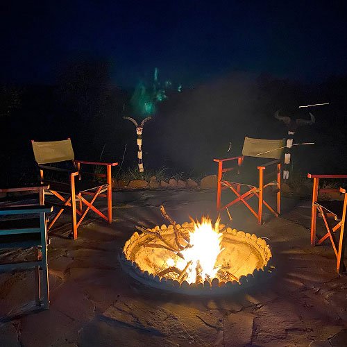 Mara Siligi Camp evening firepit and safari chairs