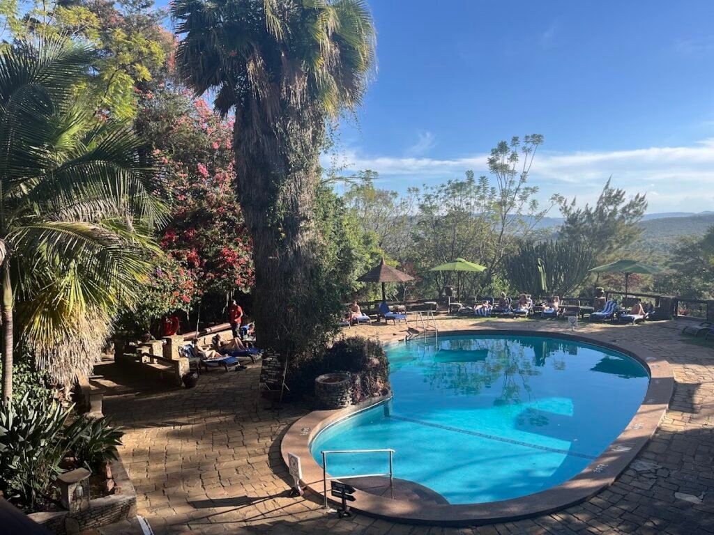 Shared pool and mature garden terrace at Mara Sopa Lodge