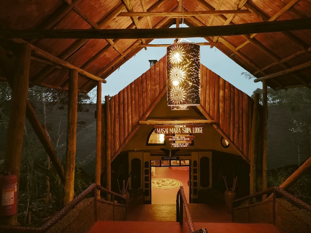 Mara Sopa Lodge timber entrance and reception walkway beneath hanging lanterns