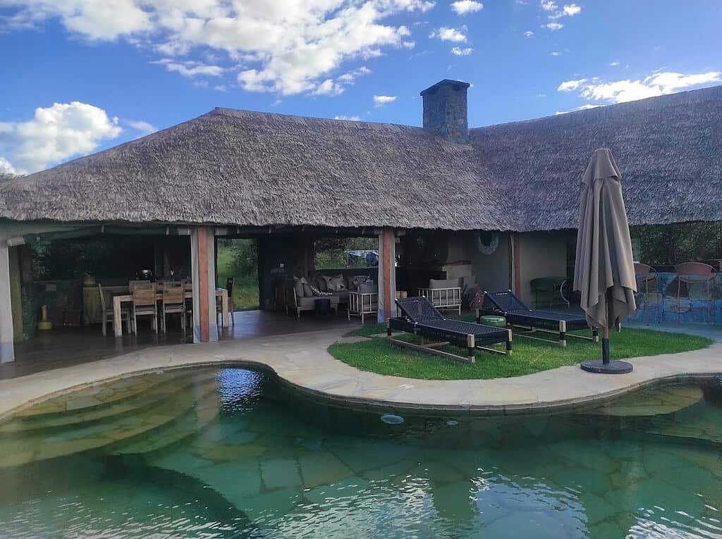 Naboisho Camp swimming pool beside its open lounge