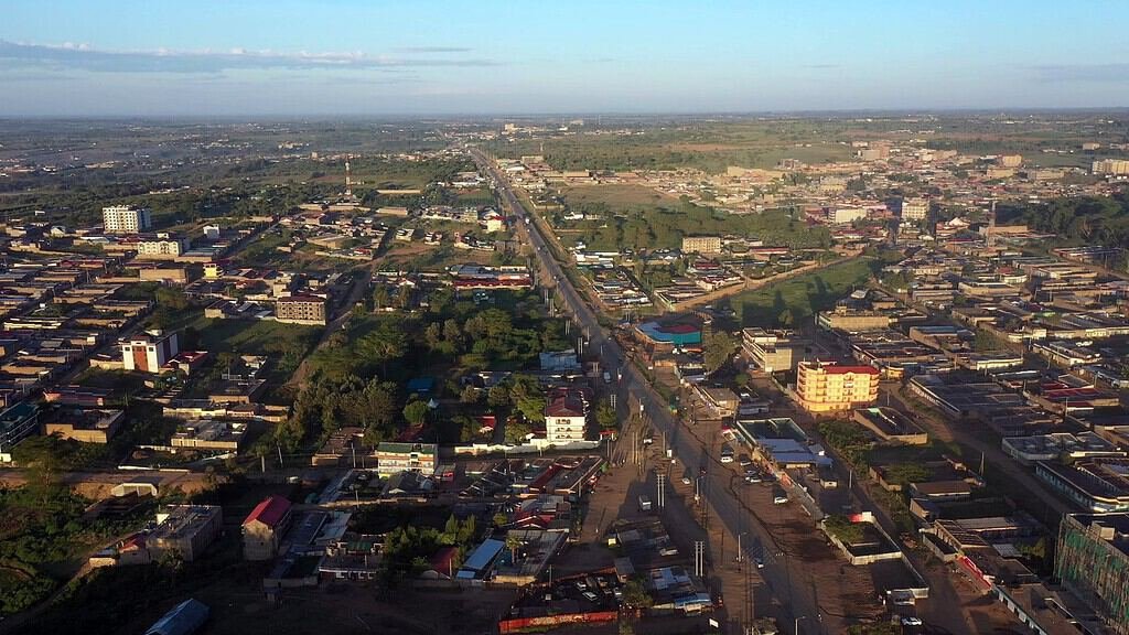 Aerial view of Narok town with its main road running through the middle towards the Maasai Mara
