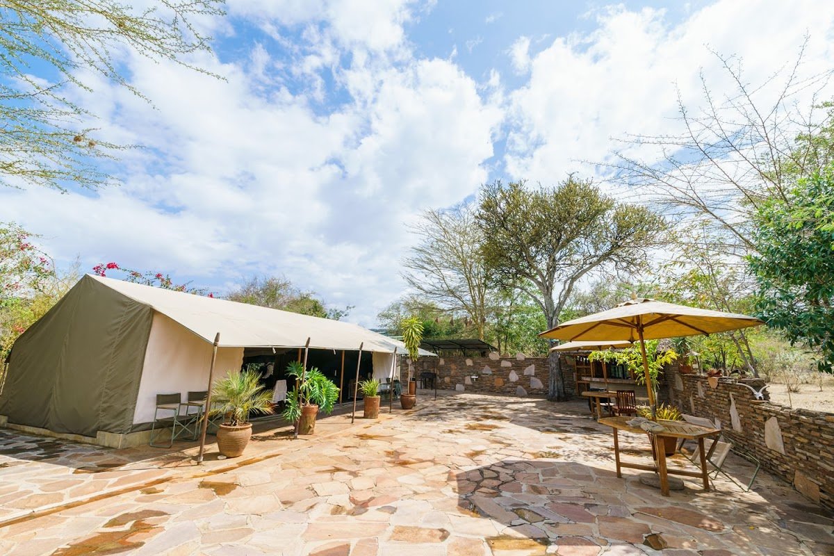 Archive photograph of a tent and stone terrace at Olkeri Mara Safari Camp