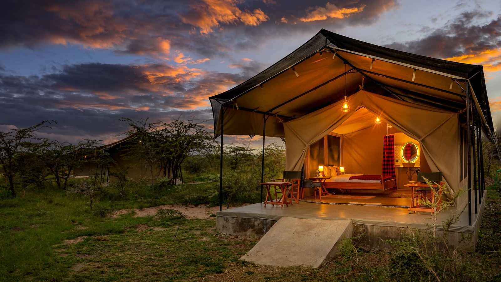 Furnished safari tent and veranda at Oltepesi Tented Safari Camp
