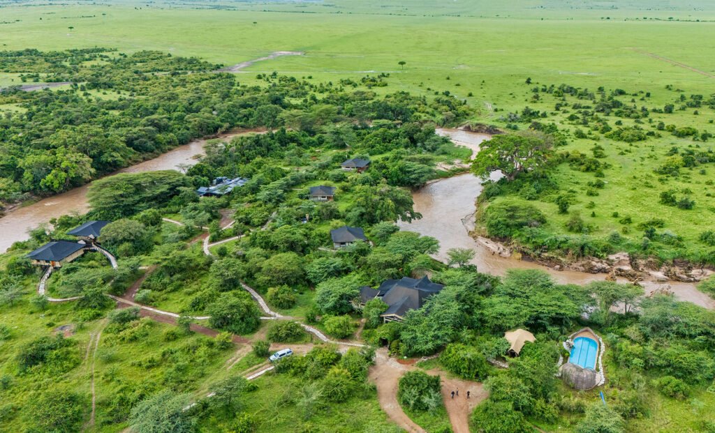 Osero Sopia River Camp accommodation, paths and pool beside a bend of the Talek River