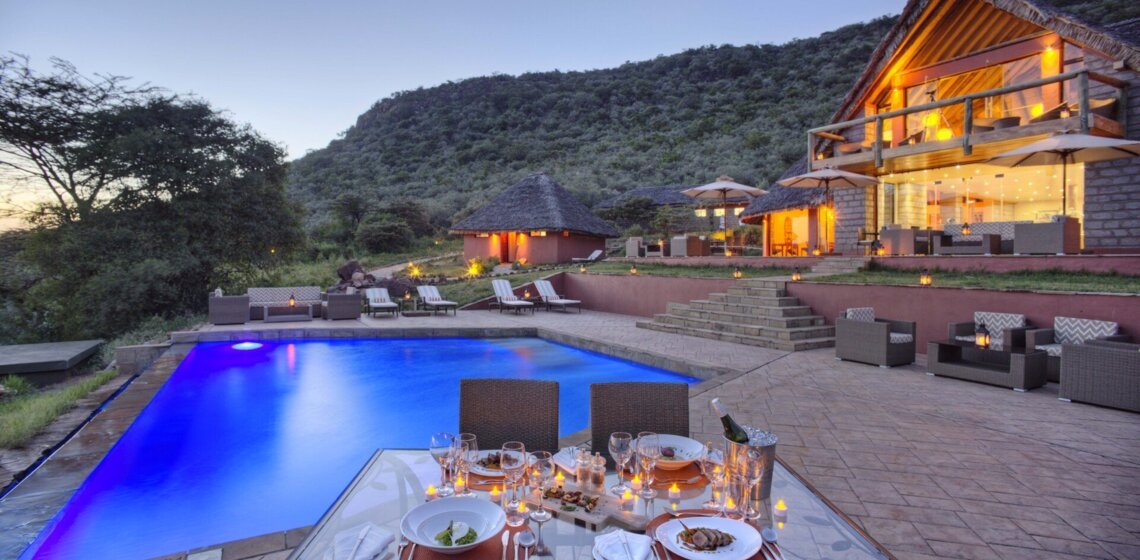 Ososian Mara Lodge swimming pool and dining terrace at dusk