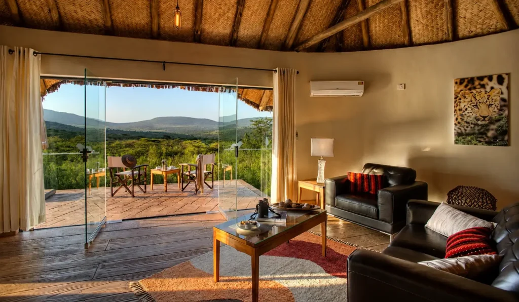 Ososian Mara Lodge suite lounge opening onto a private terrace with valley views