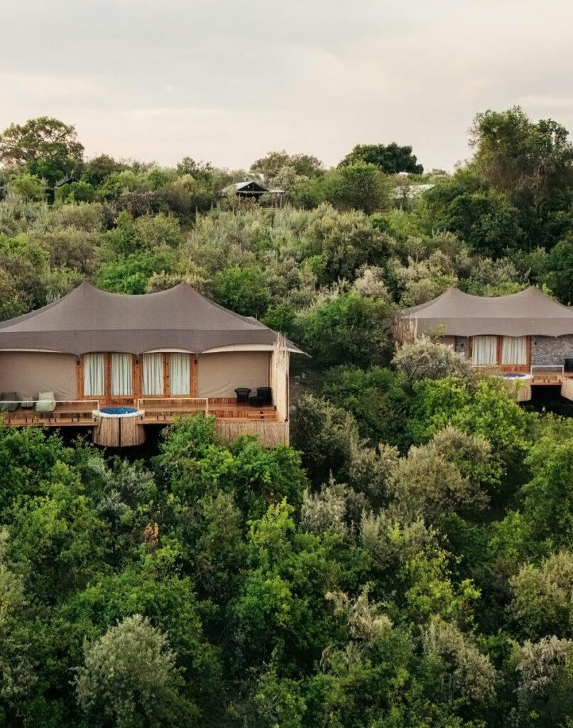 Pearl Mara suites with decks and small circular outdoor Jacuzzis among trees