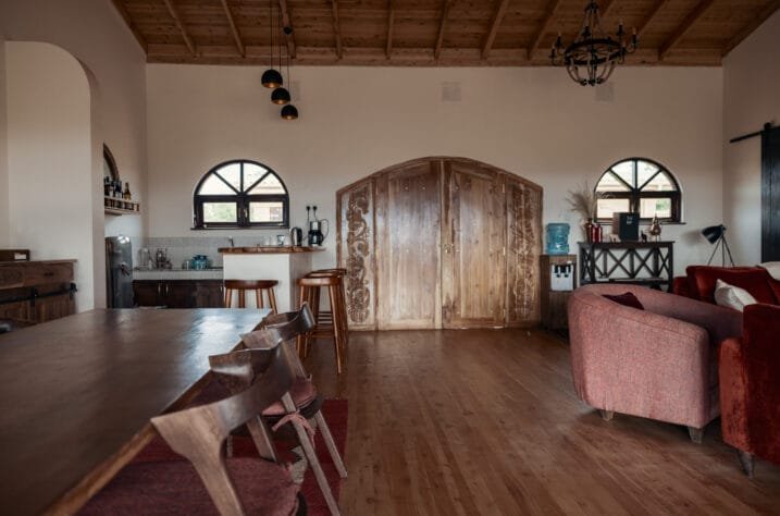 Porini Safari Cottages shared dining and lounge interior with timber furniture