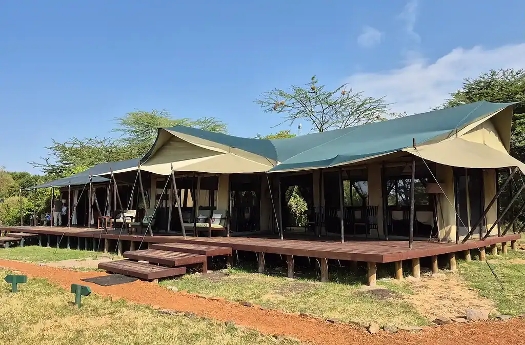 Maasai Mara lodges and camps 48 Porini Lion Camp shared canvas main area and raised wooden deck