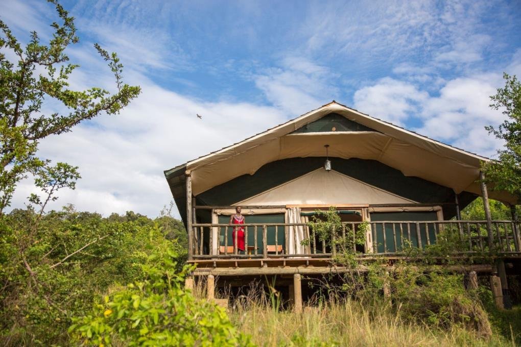Maasai Mara lodges and camps 58 Mara Engai Wilderness Lodge raised canvas suite with a wooden veranda among trees