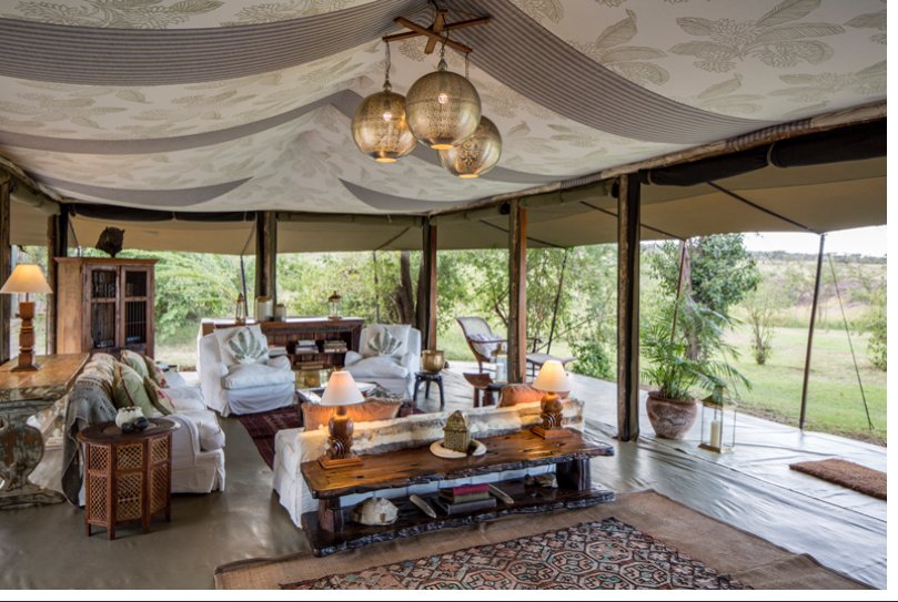 Hemingways River Camp Mara mess lounge with canvas canopy and timber furniture