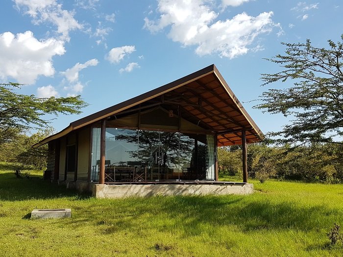 Maasai Mara lodges and camps 120 Simba Oryx Camp glass-fronted Mara tent with a timber roof and private veranda